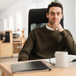 Entrepreneur working with a laptop and documents